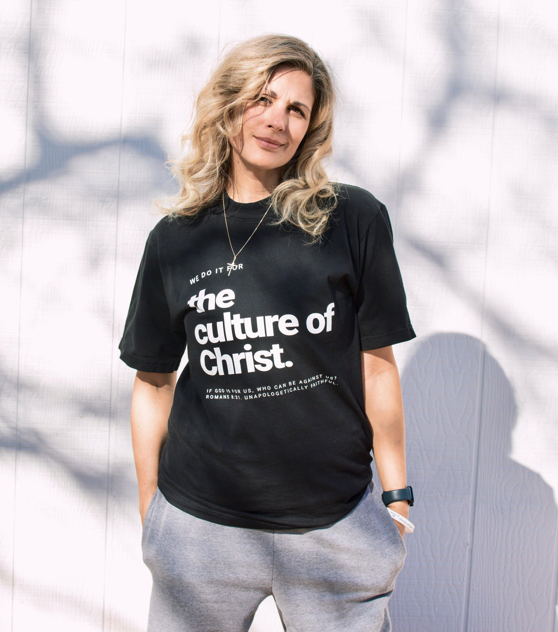 Model wearing The culture of Christ Catholic heavyweight tee black unisex front view.